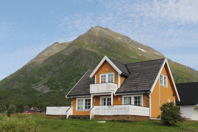house with metal roof near the mountains